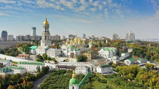 Panoramic aerial view of Kyiv Pechersk Lavra. High resolution drone shot of monastery complex in summer, showcasing golden domes and historic architecture in Kiev.
