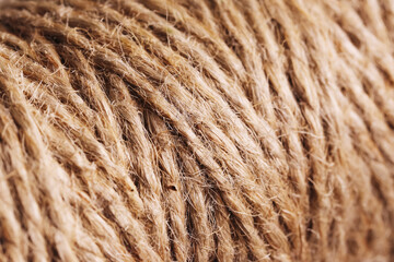 Natural brown jute twine close-up. Detailed texture of rough fiber thread roll. Rustic cord...