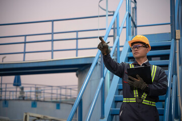 Petrochemical engineer working at petroleum oil refinery industry area. Industrial technician...