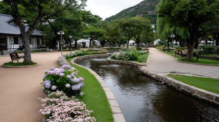 Purple hydrangeas flourish alongside vibrant flower beds, creating a serene atmosphere with winding streams and rich greenery