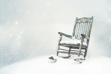 A snow-covered rocking chair sits alone in a winter wonderland, evoking feelings of peace and...