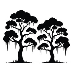 Silhouette of two oak trees with hanging moss

