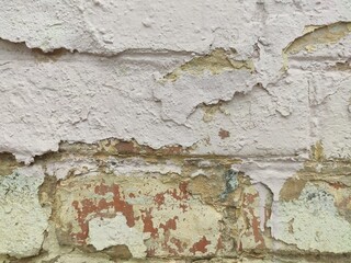 Lower wall section with layers of peeled paint and color loss for vintage textures and visual...