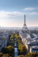 Naklejka premium Iconic cityscape featuring a canal lined with trees, buildings, and the renowned Eiffel Tower under a bright sky. Perfect for travel, culture, or architectural themes.