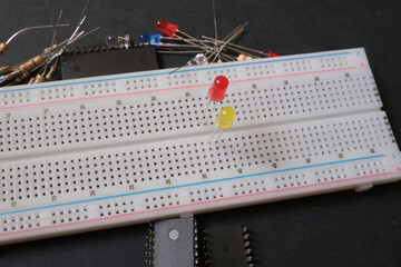 Electronic learning on the breadboard. Focused on green and yellow leds. 