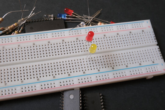 Electronic learning on the breadboard. Focused on green and yellow leds. 