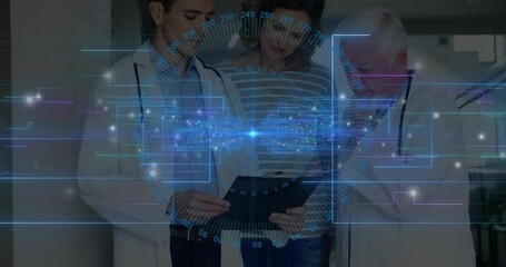 Mature woman between doctors, younger doctor tapping tablet showing medical data chart overlay - Powered by Adobe