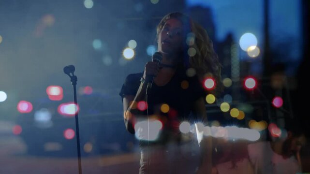 Singer stepping into view on music stage with mic hitting pitch and connecting crowd amid bokeh