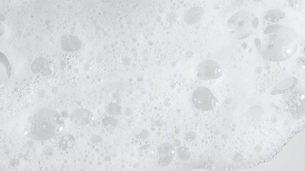 Texture of white soap foam with bubbles abstract background. Soap sud macro structure. Bathtup Soap Foam. Natural White Shampoo Bubbles Motion. High quality 4k footage - Powered by Adobe