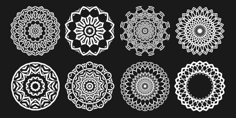 Eight lacy white mandalas, round ornaments, designs for your projects on a black background. Vector set
