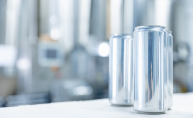 Aluminum cans mockup on blur background Modern beer factory drink production