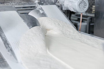 Automated dough formation in puff pastry production at confectionery facility