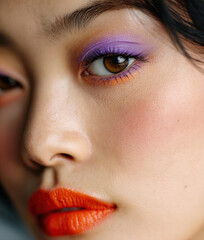 Beautiful young Asian woman with bright colorful make-up	