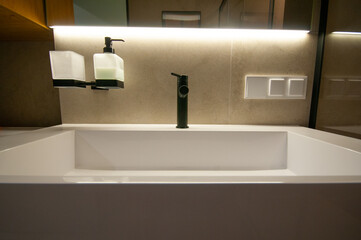 Interior of  contemporary bathroom with ceramic sink and faucet