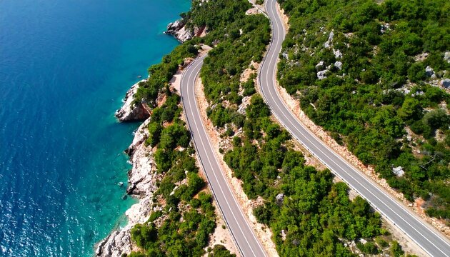 Coastal road winds by blue sea, green trees - Powered by Adobe