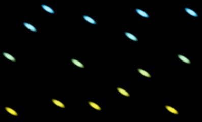 Abstract pattern of blurred colorful oval lights on a black background