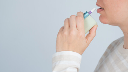 Caucasian woman smoking electronic cigarette. Tobacco heating system.