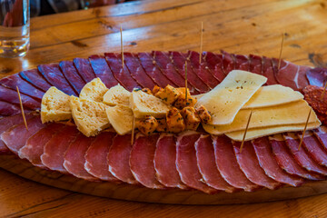 Selection of meats and cheeses on a platter - selective focus