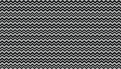 Colorful chevron stripes in black, grey, and light grey– modern repeating pattern.
