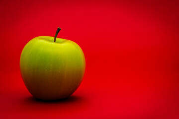 Fresh green apple on red background still life healthy eating fruit food photography stock image and wallpaper