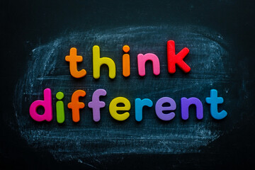 Think different colorful letters on blackboard creative thinking and innovation concept for education