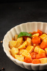 Stewed potatoes with carrots vegetarian side dish fresh delicious gourmet food background on the table rustic food top view copy space keto and paleo diet vegan food
