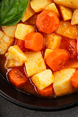 Stewed potatoes with carrots vegetarian side dish fresh delicious gourmet food background on the table rustic food top view copy space keto and paleo diet vegan food