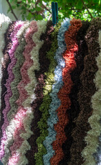 Bath mat hangs on a string in the sun and dries