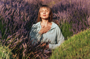 Woman Practicing Meditation and Breathing Exercises in Lavender