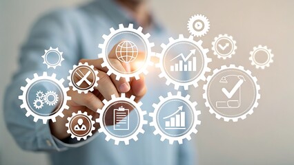 Photo of a persons hand points to a glowing gear in a network of gears representing global business growth and strategy