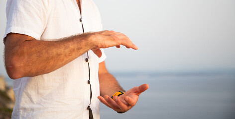 man doing qigong by the sea