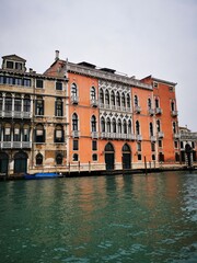 Beautiful historic architecture along the Grand Canal in Venice, Italy on a cloudy day