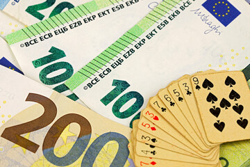 European Union banknotes and the playing cards on top
