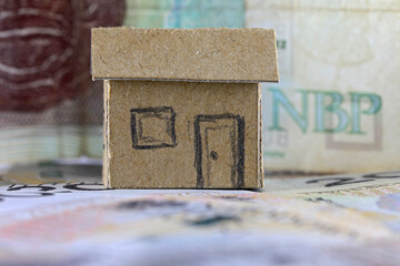 Freestanding house model and Polish banknotes