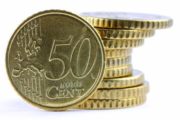 Stack of fifty-euro-cent coins, one coin showing the obverse side, EUR currency