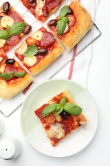 Tasty homemade pizza on white table, flat lay