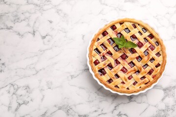 Tasty cherry pie on white marble table, top view. Space for text