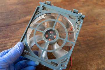 Cleaning the computer fan from dust.Cooler contamination.Disassemble the fan on household appliances.