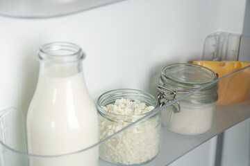 Different dairy products in fridge, closeup view