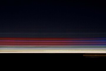 Horizontal Light Streaks on Dark Background Abstract