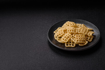 Lattice or wafer potato chips, crispy yellow snacks, takeaway food