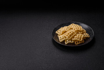 Lattice or wafer potato chips, crispy yellow snacks, takeaway food