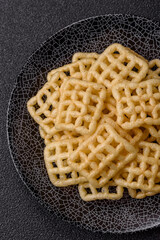 Lattice or wafer potato chips, crispy yellow snacks, takeaway food