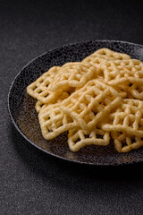 Lattice or wafer potato chips, crispy yellow snacks, takeaway food