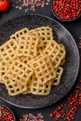 Lattice or wafer potato chips, crispy yellow snacks, takeaway food