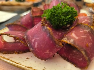 Top view sliced ​​air dried meat on plate