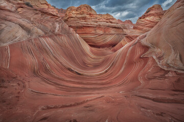 The Wave in Vermilion Cliffs, USA, showcases surreal sandstone formations with wave-like patterns...