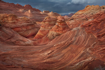 The Wave in Vermilion Cliffs, USA, showcases surreal sandstone formations with wave-like patterns...