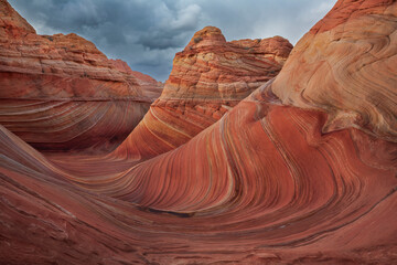 The Wave in Vermilion Cliffs, USA, showcases surreal sandstone formations with wave-like patterns...