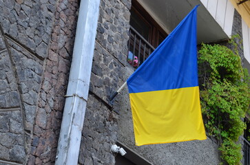 Ukrainian Flag Displayed on Building Exterior